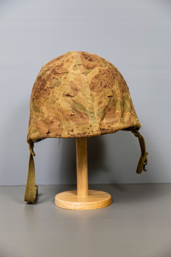 Bloodstained helmet from Jack Jackson, dated April 1, 1945. Was worn through 2 Marine invasions.