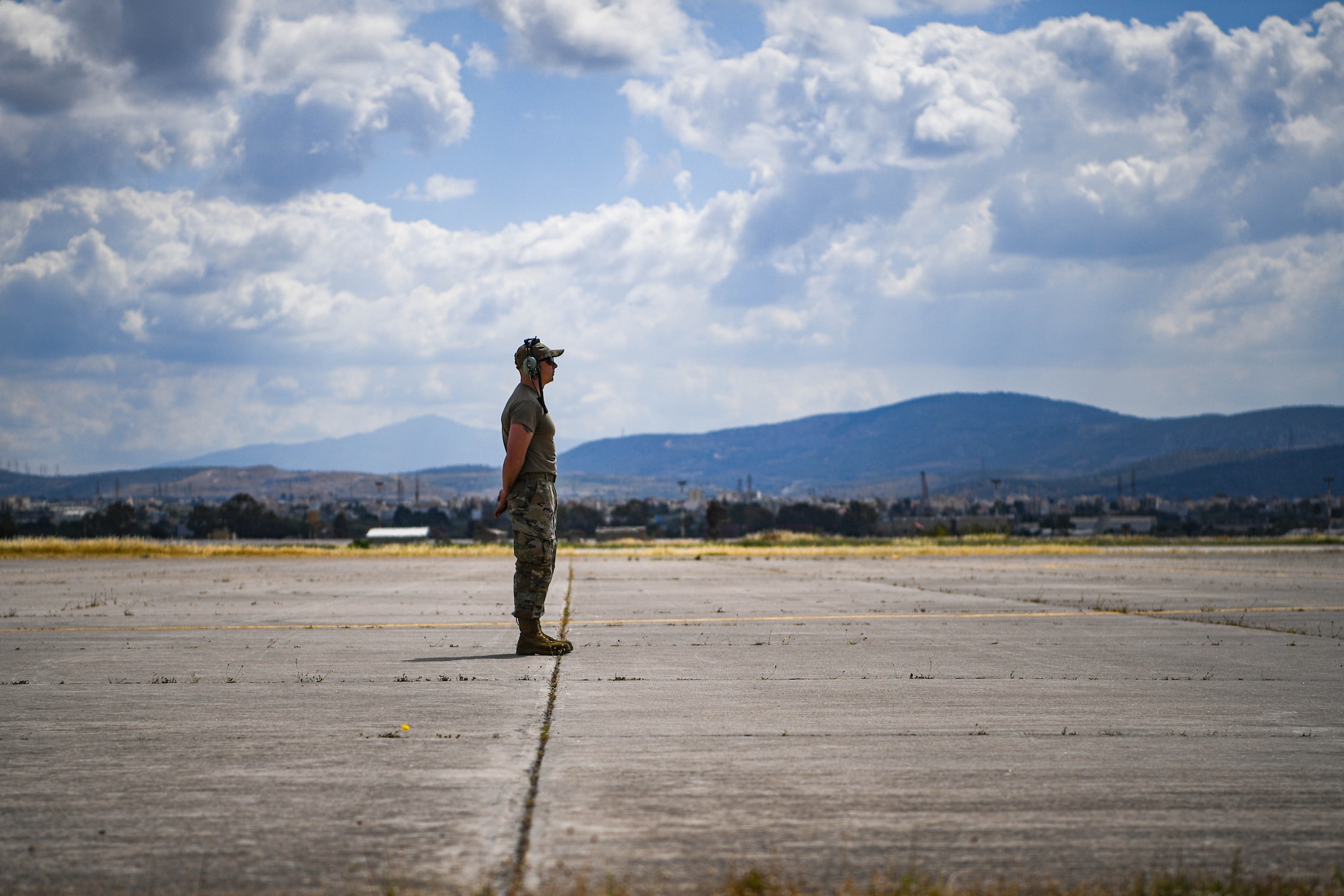 An Airman stands on the flightline.