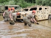 Soldiers with the Army active, Reserve, and National Guard components attend a vehicle recovery course at the Regional Training Site-Maintenance (RTS-M), 177th Regiment, Regional Training Institute, Fort Custer Training Center, Augusta, Michigan, May 19, 2022. With 13 training centers available throughout the Army, Michigan’s RTS-M runs approximately 24 classes and averages 396 students per year. The RTS-M has added unique training to the wheeled vehicle recovery course which includes land navigation to locate disabled vehicles. (U.S. Air National Guard photo by Master Sgt. David Eichaker)