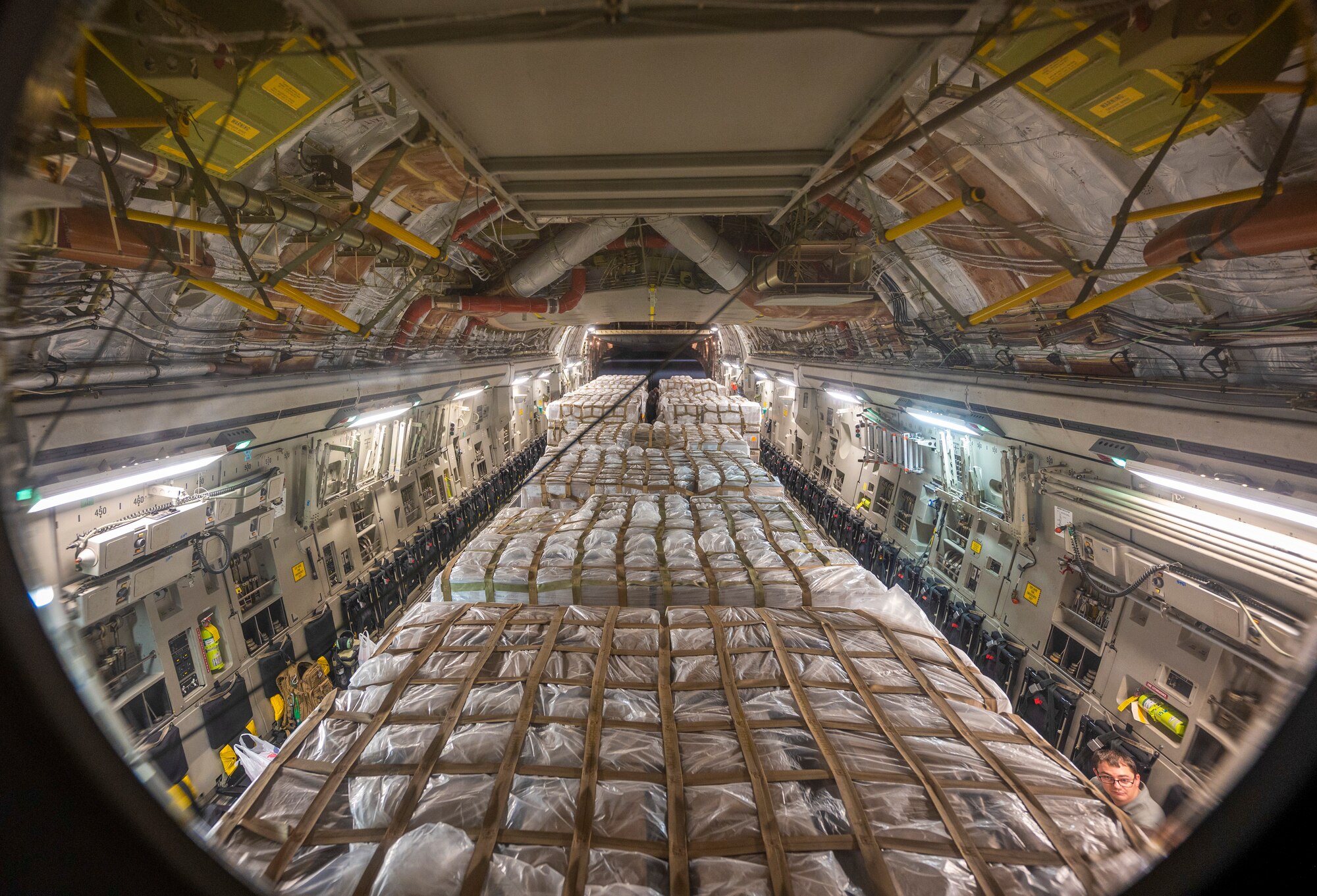 A C-17 Globemaster III assigned to Joint Base Pearl Harbor-Hickam, Hawaii carries pallets of infant formula at Ramstein Air Base, Germany, May 22, 2022. Hundreds of boxes of infant formula arrived from Switzerland and were unloaded, palletized and loaded on a C-17 for transport during Operation Fly Formula, an operation to quickly import infant formula to the United States that meets U.S. health and safety standards. (U.S. Air Force photo by Staff Sgt. Jacob Wongwai)
