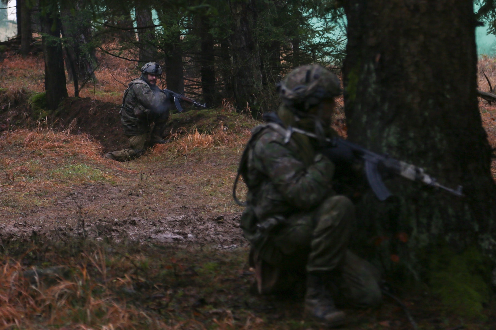 Slovakian soldiers take cover and provide security during Combined Resolve XVI at the Hohenfels Training Area, Germany, Dec. 14, 2021.