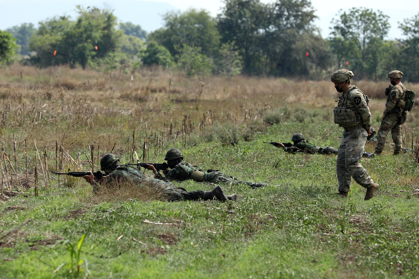 U.S. Army infantrymen with the 4th Battalion, 23rd Infantry Regiment, 2nd Stryker Brigade Combat Team, 7th Infantry Division, instructs a team of soldiers from the 112th Infantry Regiment, Royal Thai Army, during a dismount training exercise during Cobra Gold 2022 in the Lopburi Province of the Kingdom of Thailand, Feb. 26, 2022.