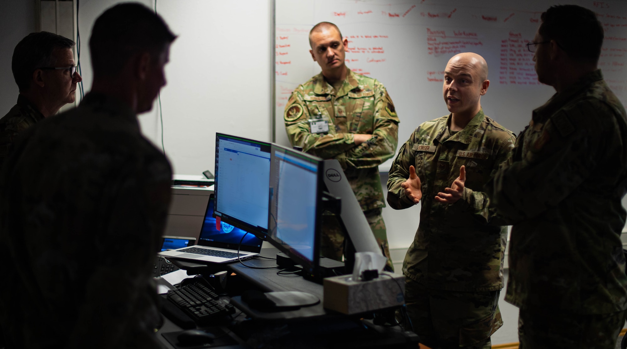 U.S. Air Force Tech. Sgt. Daniel Bowser, 1st Combat Communications Squadron mission defense team section chief assigned to Ramstein Air Base, Germany, discusses the integrity of data with other participants of Tacet Venari during the exercise at Ramstein Air Base, May 19, 2022. Tacet Venari is United States Air Forces in Europe – Air Forces Africa’s two-week long premiere defensive cyberspace operational training targeted at USAFE’s mission defense team. The hands-on experience the exercise provides prepares Airmen for real-world cyber threat scenarios. (U.S. Air Force photo by Airman 1st Class Jared Lovett)