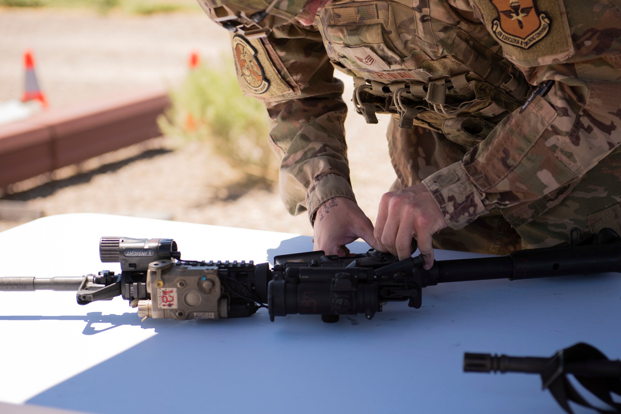 Staff Sgt. James Rowan, 49th Security Forces Squadron patrolman, assembles a rifle during the Defender Challenge at the Security Forces Training Complex May 11, 2022, on Holloman Air Force Base, New Mexico. The event saw four-person teams navigate through a series of obstacles and challenges ranging from weapon disassembly/reassembly to sweeping and clearing rooms of simulated enemy threats. (U.S. Air Force photo by Airman Isaiah Pedrazzini)