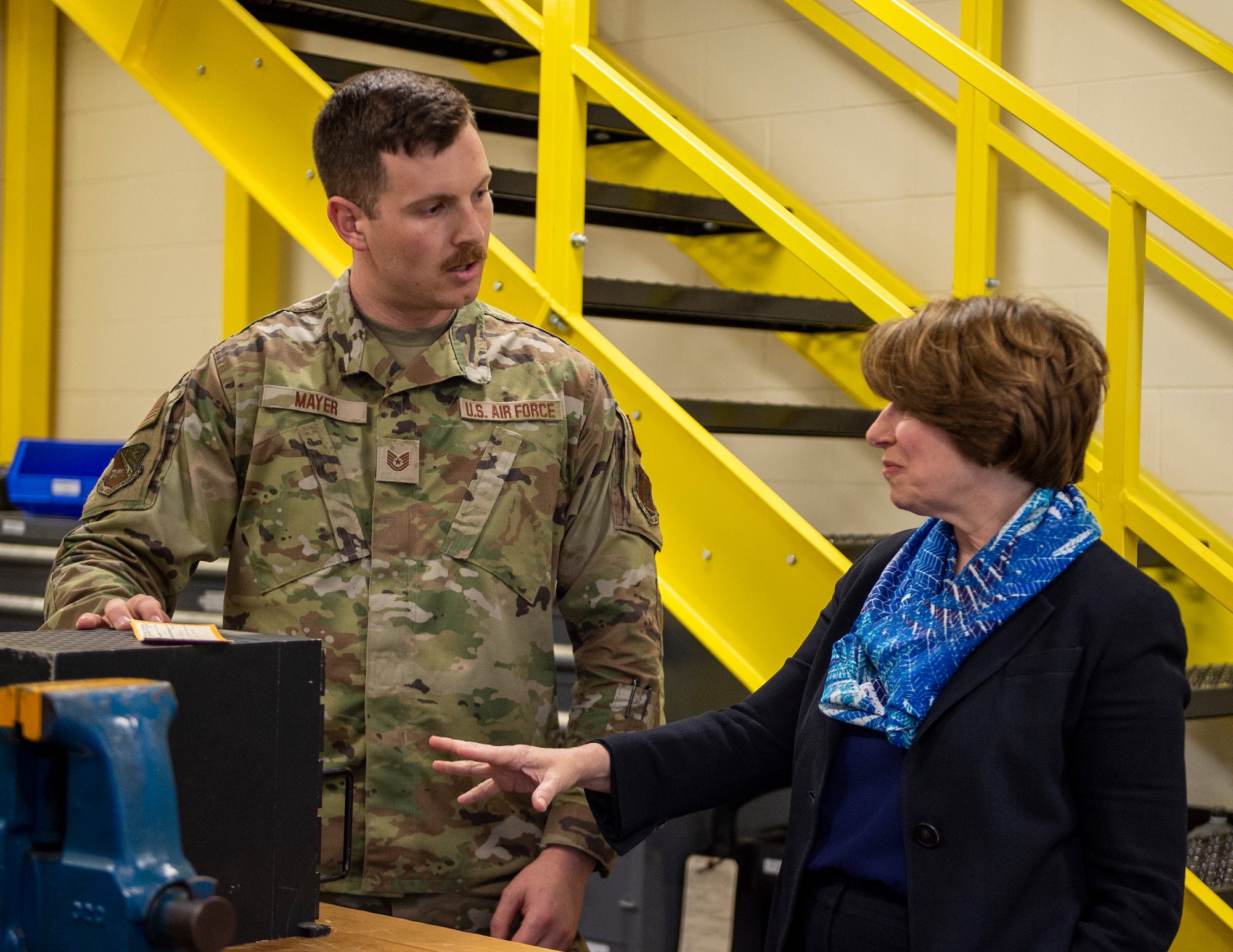 U.S. Air Force Tech. Sgt. Kyle Mayer, 133rd Maintenance Squadron, talks about the lightning control unit project to U.S. Sen. Amy Klobuchar, D-Minn., in St. Paul, Minn., May 22, 2022.