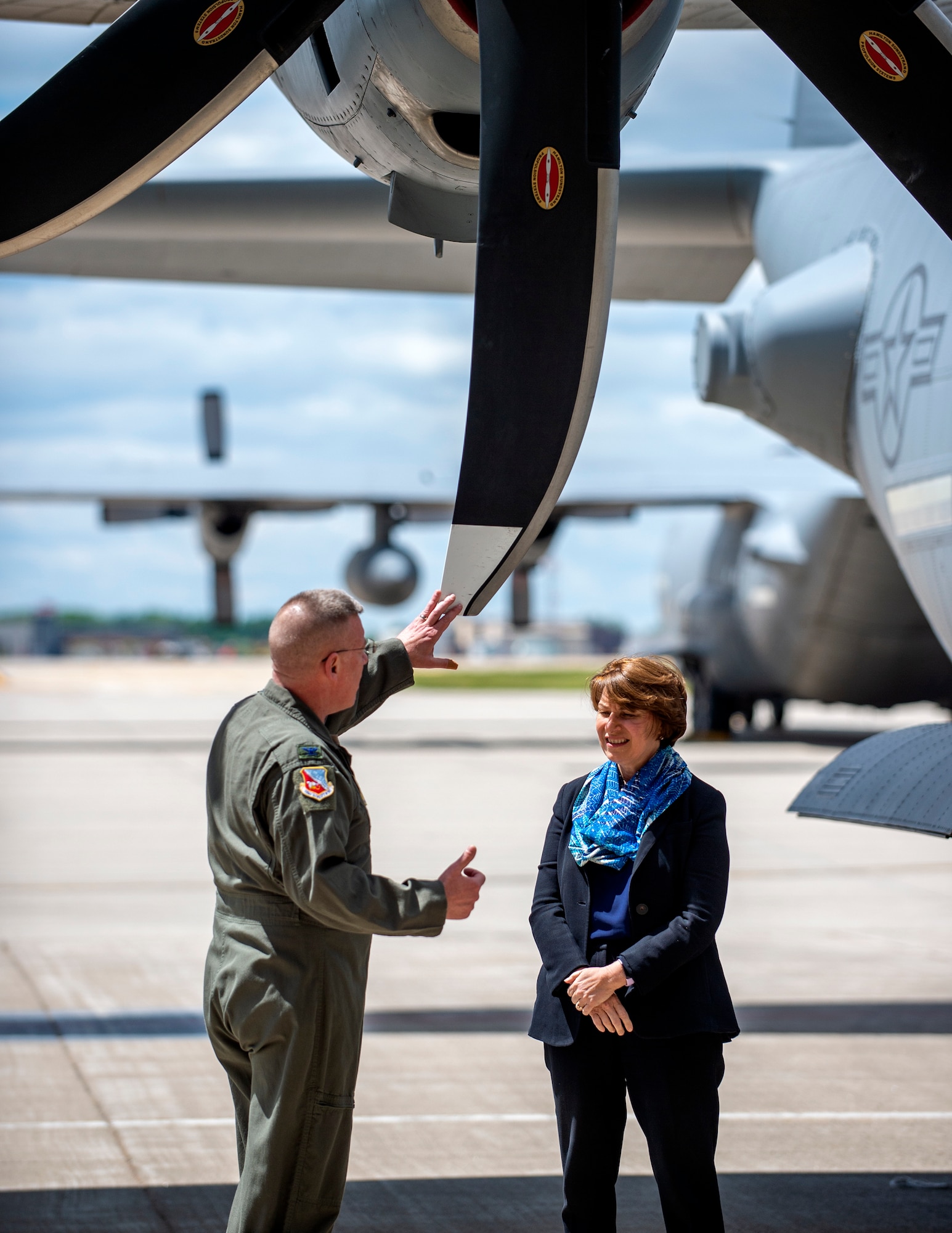 U.S. Air Force Col. James Cleet, Commander, 133rd Airlift Wing and U.S. Sen. Amy Klobuchar, D-Minn., discuss the eight-bladed propeller upgrade to the C-130 in St. Paul, Minn., May 22, 2022.