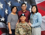 Spc. Michael Delos Trinos, at center, with his family. (Courtesy photo)