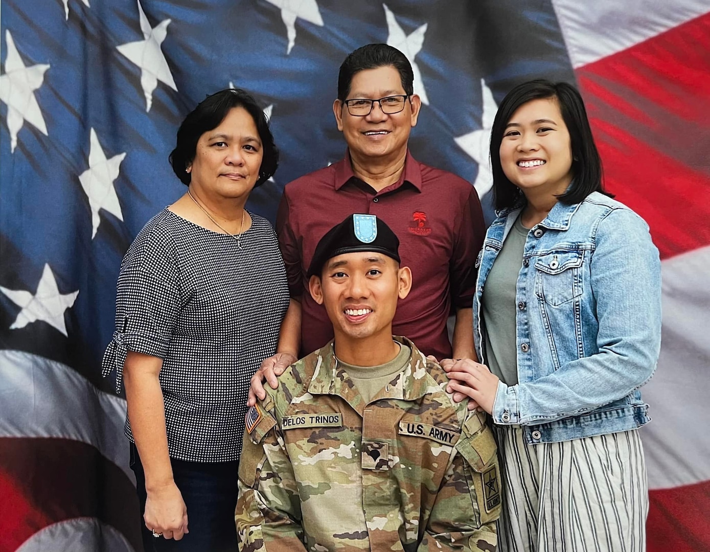 Spc. Michael Delos Trinos, at center, with his family. (Courtesy photo)