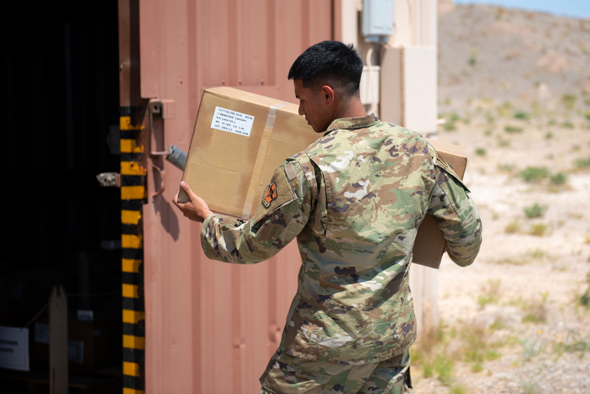 Senior Airman Alfred Martinez, 49th Equipment Maintenance Squadron munitions storage crew chief, transports supplies, May 18, 2022, on Holloman Air Force Base, New Mexico.