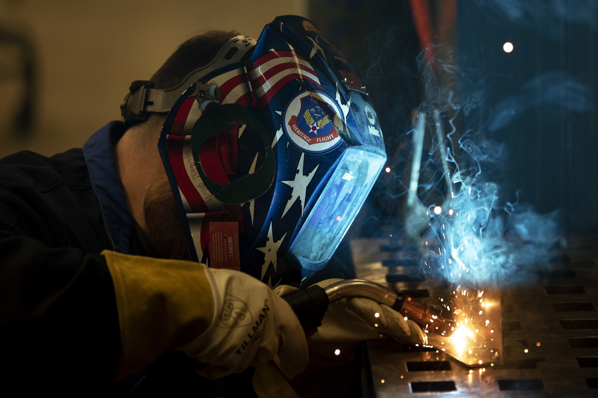 Josh Crutchfield, a civilian contractor for the 8th Aircraft Maintenance Unit, welds pieces of metal together, May 18, 2022, on Holloman Air Force Base, New Mexico.