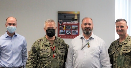 Gary Kirkpatrick, Supervisor of Shipbuilding Groton, Executive Director; Captain Andrew Gillespy, Supervisor of Shipbuilding Groton, Supervisor; Kevin Castleberry, Supervisor of Shipbuilding Groton, VIRGINIA Class Construction Manager, Changes/CM Division; and Vice Adm. William Galinis, Commander, Naval Sea Systems Command gather for a group photo on Kevin’s special occasion.