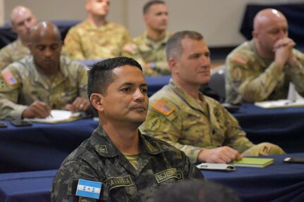 A Honduran Army officer takes part in an operational briefing with members of the 54th Security Forces Assistance Brigade prior to the start of the command post exercise during CENTAM Guardian 22. CENTAM Guardian 22 is a multinational exercise aimed at enhancing interoperability among the participating nations in areas of security as well as humanitarian assistance and disaster response operations during the three-week exercise.