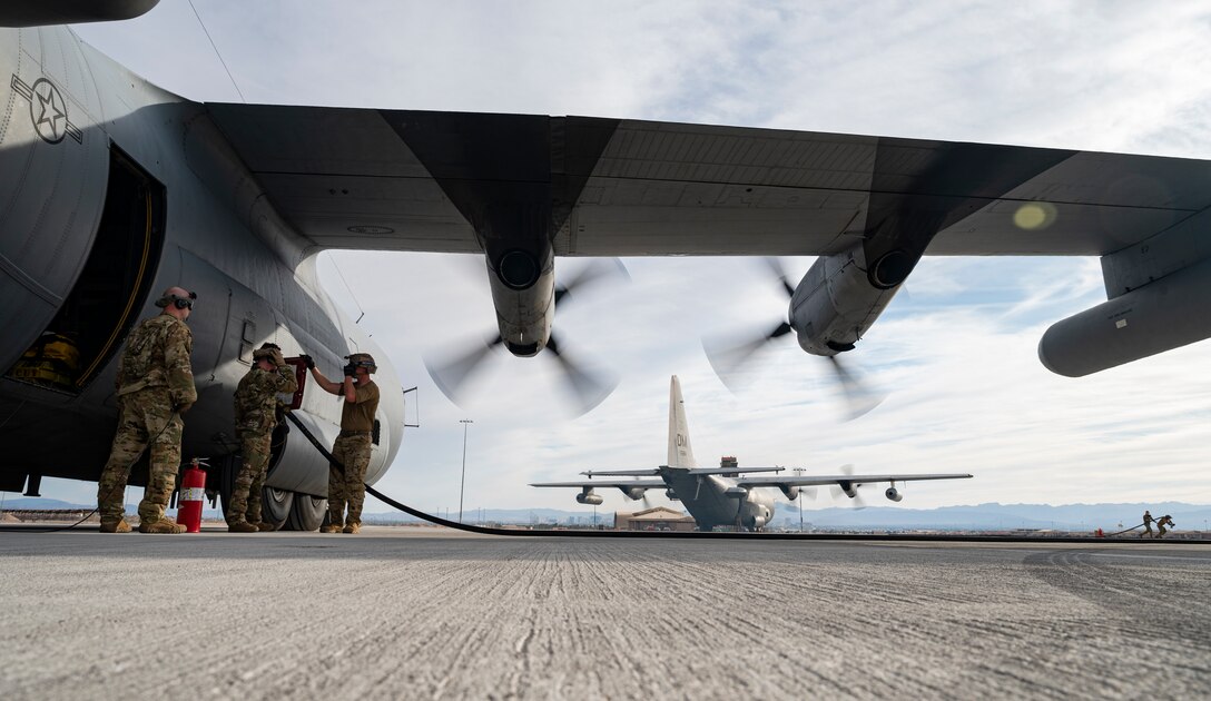 Two EC-130H Compass Call aircraft assigned to Davis-Monthan Air Force Base are refueled at a Forward Area Refueling Point (FARP) during Black Flag 22-1 at Nellis AFB, May 10, 2022.
