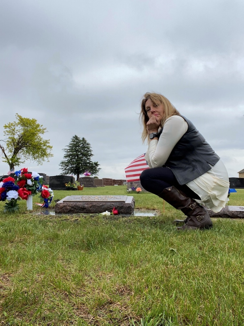 U.S. Navy Reservist, Personnel Specialist 1st Class Kitara Byerly looks over her husband’s grave in Swea City, Iowa. U.S. Army Reserve Specialist John Meyer took his life on November 16th, 2020. (Courtesy Photo)