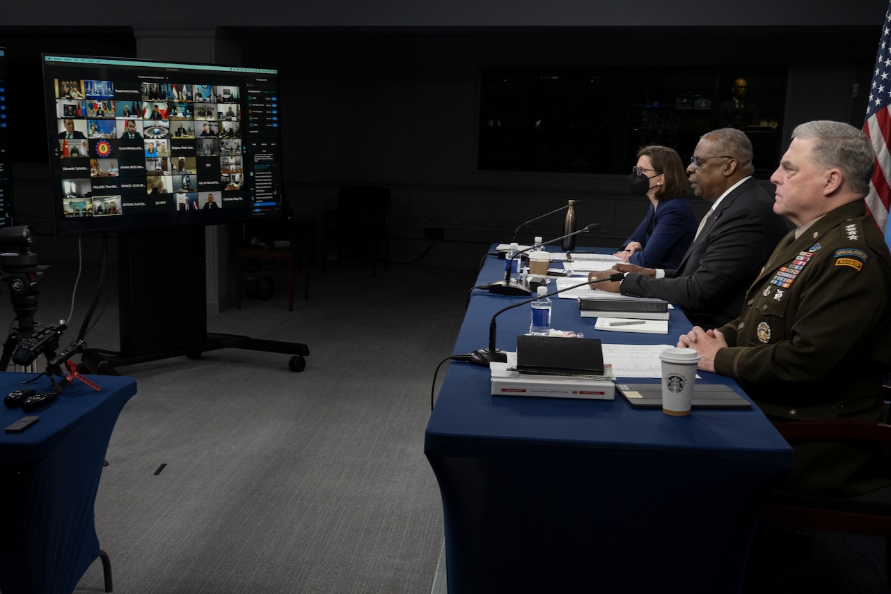 Defense leaders speak with other defense leaders via Zoom at the Pentagon briefing studio.