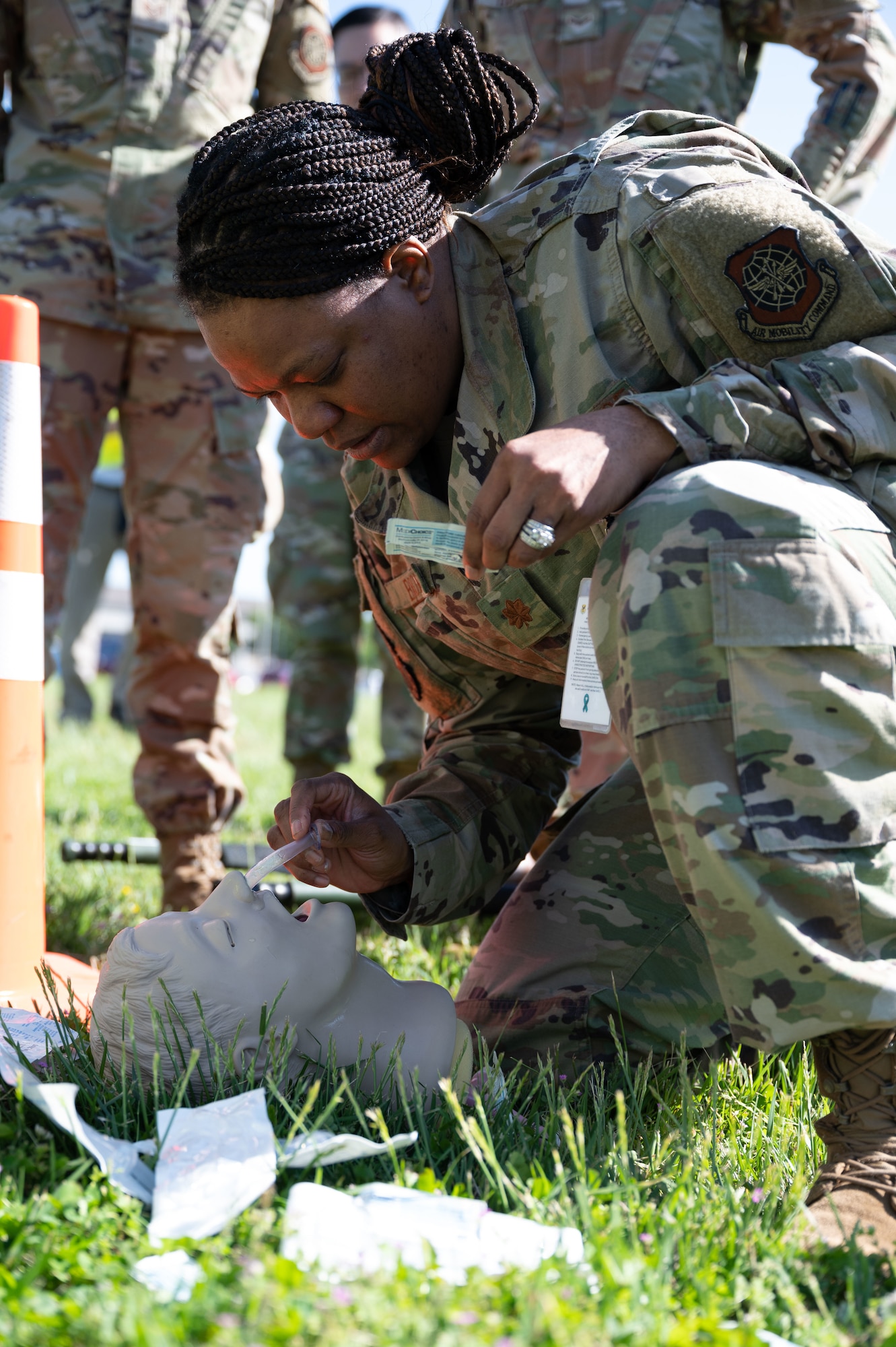 Maj. Nina Brown, 436th Operational Medical Readiness Squadron clinical nurse, inserts a nasopharyngeal airway into a simulated trauma patient during Exercise Ready Eagle on Dover Air Force Base, Delaware, May 17, 2022. The exercise promoted medical response capabilities by providing hands-on training, instruction and a final cumulative exercise. (U.S. Air Force photo by Airman 1st Class Cydney Lee)