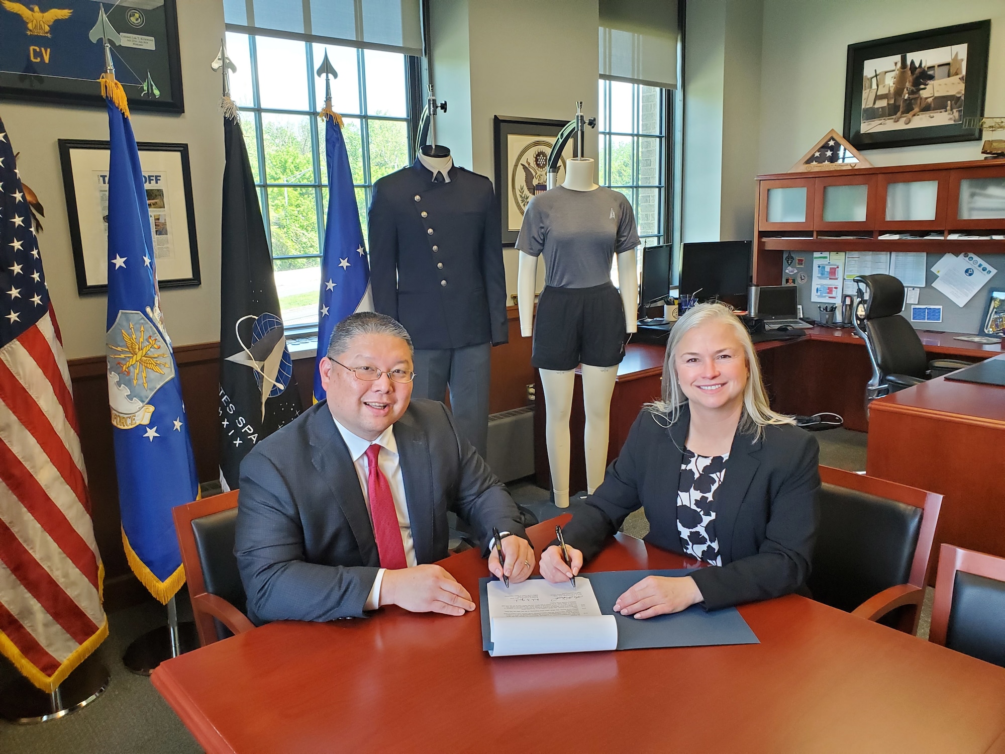 Lea Kirkwood, (right), Program Executive Officer and Director of the Air Force Life Cycle Management Center’s Agile Combat Support (ACS) Directorate, and Wade Yamada, Deputy Director of Staff, Office of the Chief of Space Operations, signed a memorandum of understanding (MOU) on May 16. The MOU outlines responsibilities related to the design, development and sustainment of U.S. Space Force uniforms.
