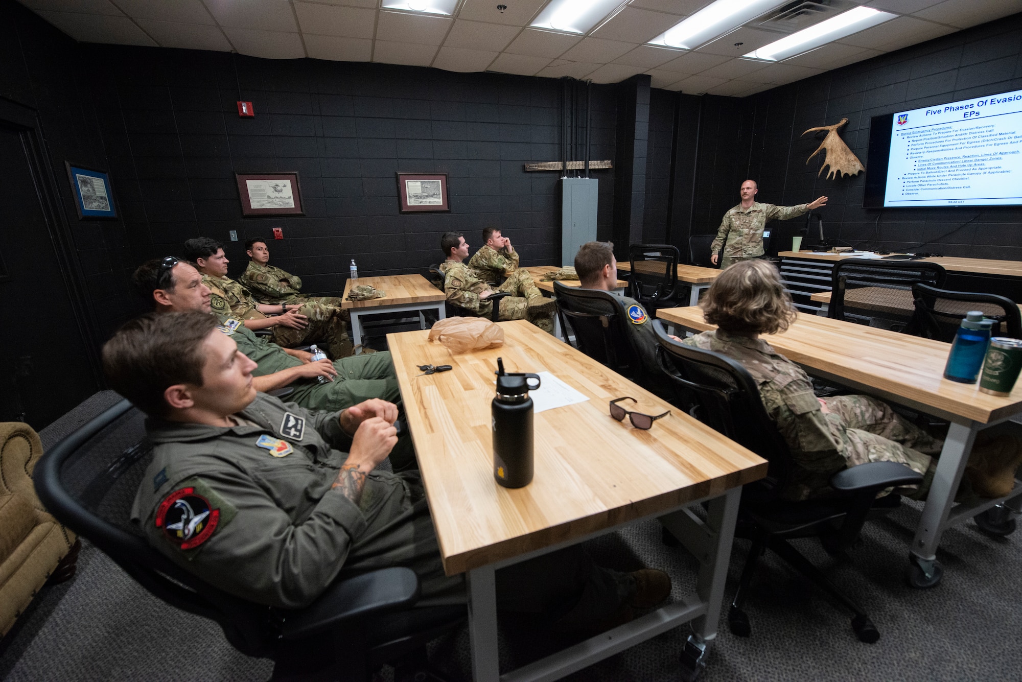 Photo of a group of Airmen sitting in a classroom.