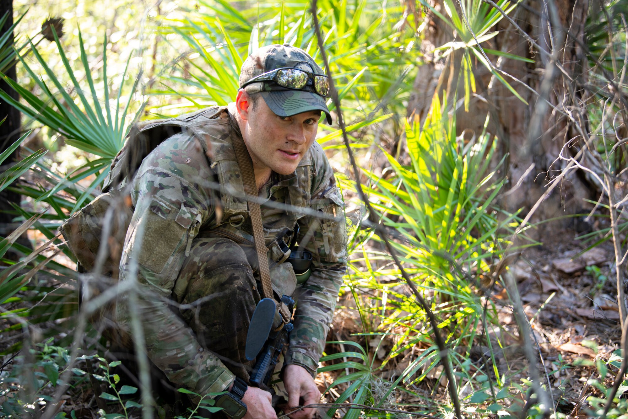 Phot of Airman in the woods for training.