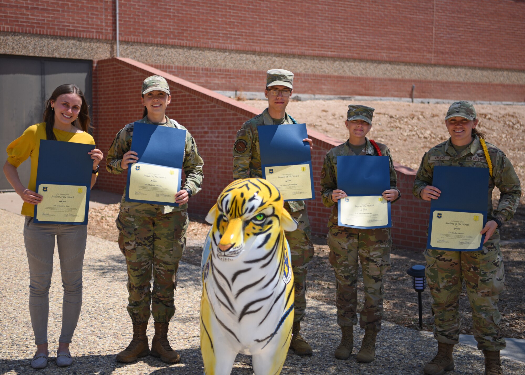 Students assigned to the 17th Training Group pose for a photo at Goodfellow Air Force Base, Texas, May 20, 2022. Students and instructors select and vote for the student they saw rise above the rest within their squadron to receive awards for Student of the Month and Rope of the Month. (U.S. Air Force photo by Senior Airman Ethan Sherwood)