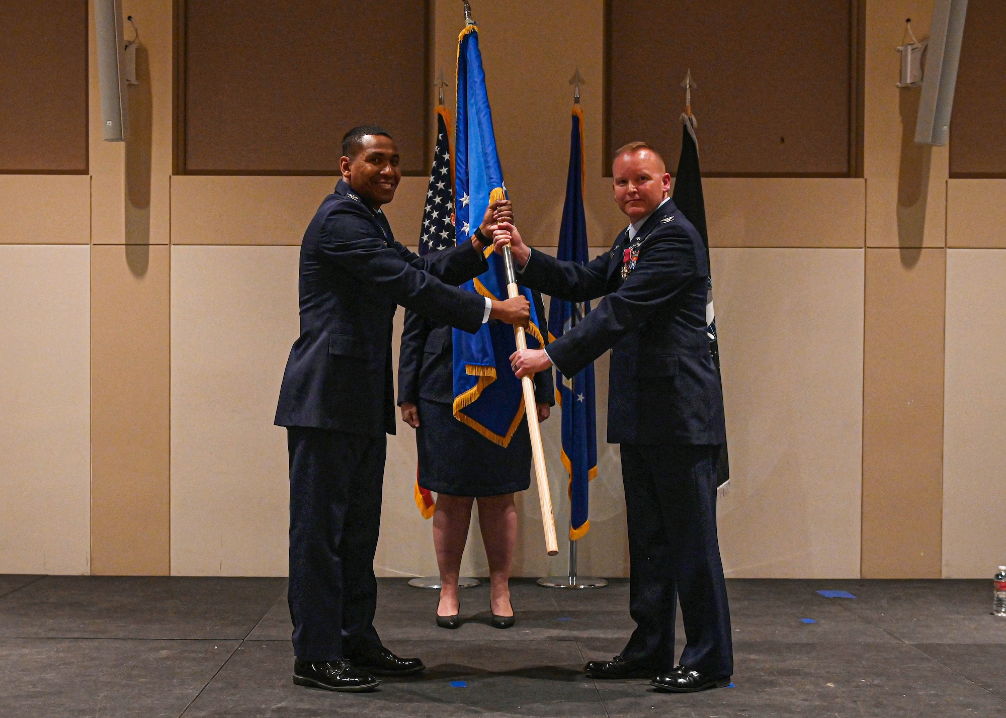 Col. Marcus Jackson, Space Base Delta 2 commander, and Col. Brian Chellgren, 460th Mission Support Group commander, pose for a photo before retiring the 460th MSG colors during an inactivation ceremony on Buckley Space Force Base, Colo., May 23, 2022.