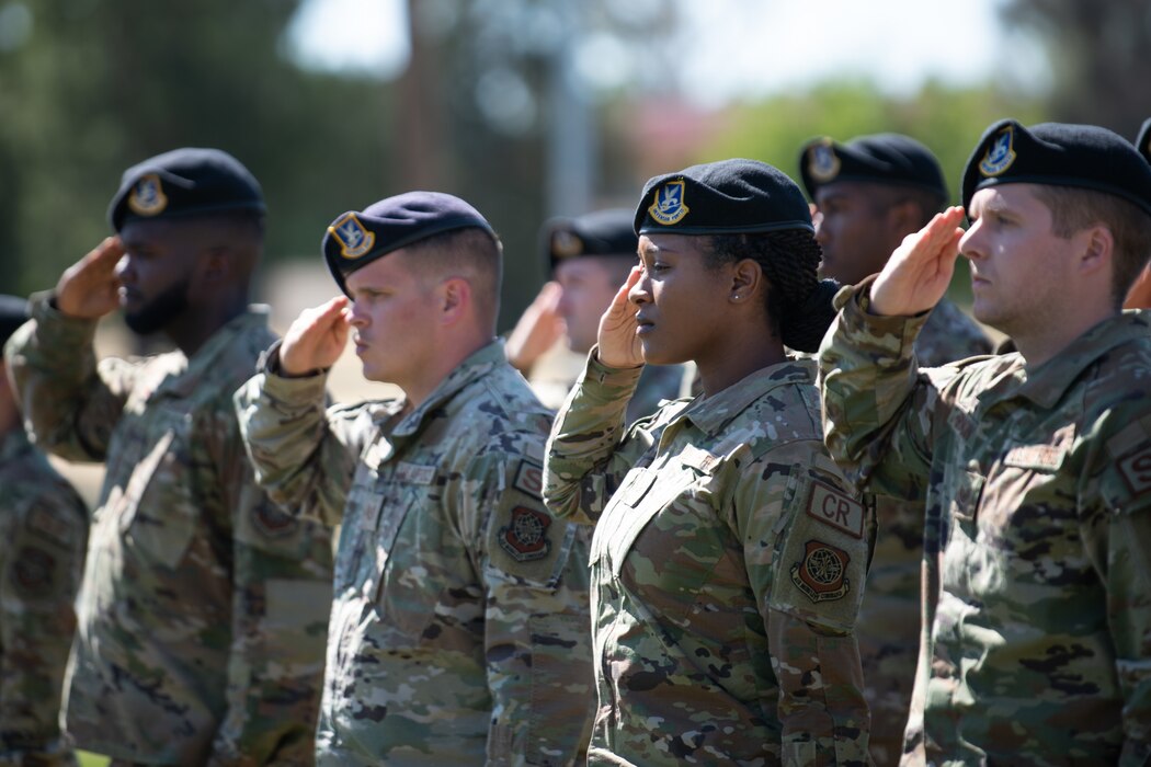 Airmen saluting