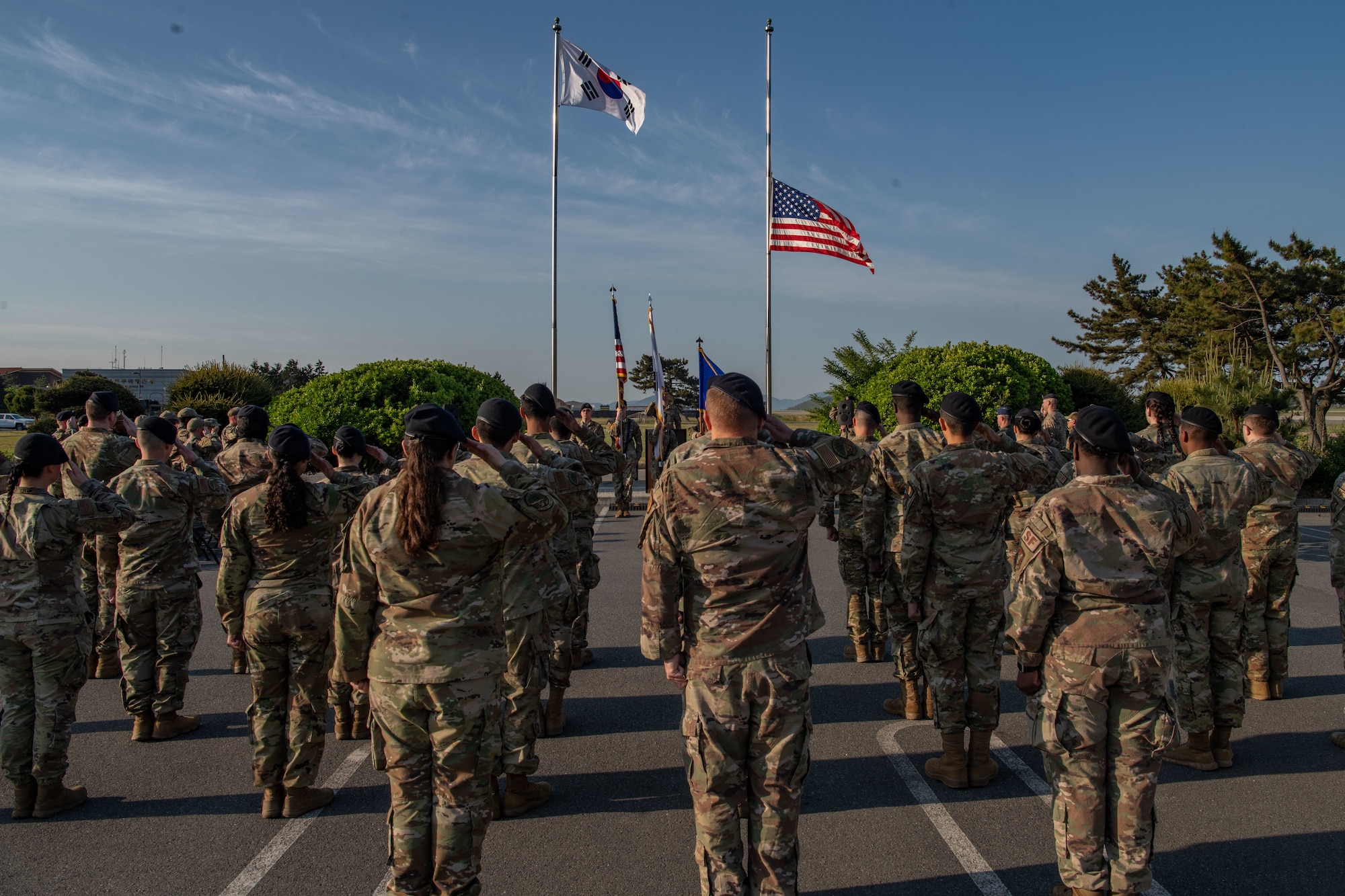 Airmen from the 8th Security Forces Squadron render a salute during Police Week 2022 opening ceremony at Kunsan Air Base, Republic of Korea, May 16, 2022. National Police Week pays special recognition to law enforcement officers who have lost their lives in the line of duty for the safety and protection of others. (U.S. Air Force photo by Staff Sgt. Jesenia Landaverde)