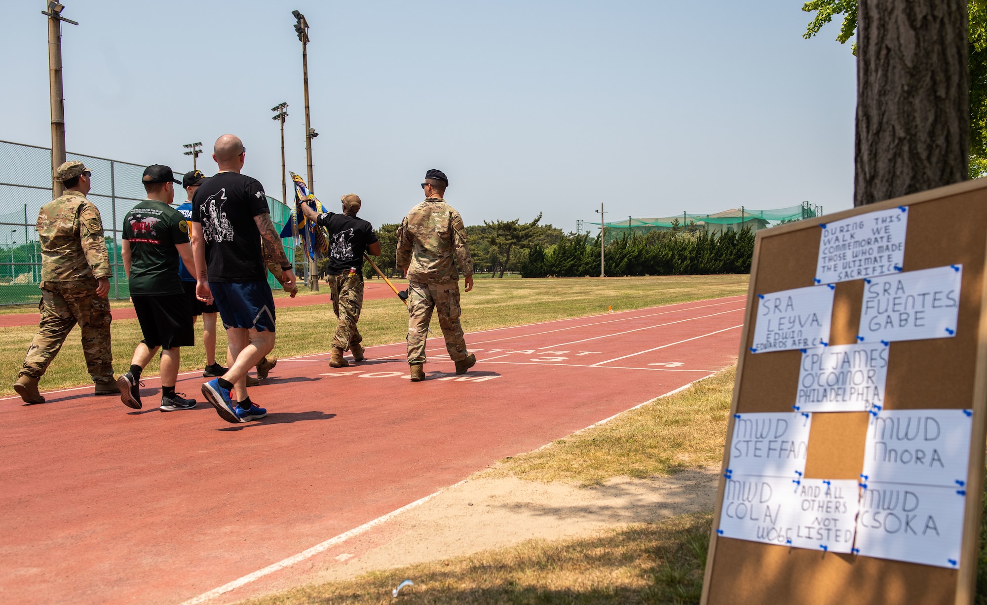 Members of the 8th Security Forces Squadron march together during a 24-hour memorial run/walk for Police Week 2022 at Kunsan Air Base, Republic of Korea, May 18, 2022.  This year’s memorial run/walk was dedicated to honoring current or former Kunsan defenders who have lost their lives in the line of duty.  (U.S. Air Force Photo by Tech Sgt. Timothy Dischinat)