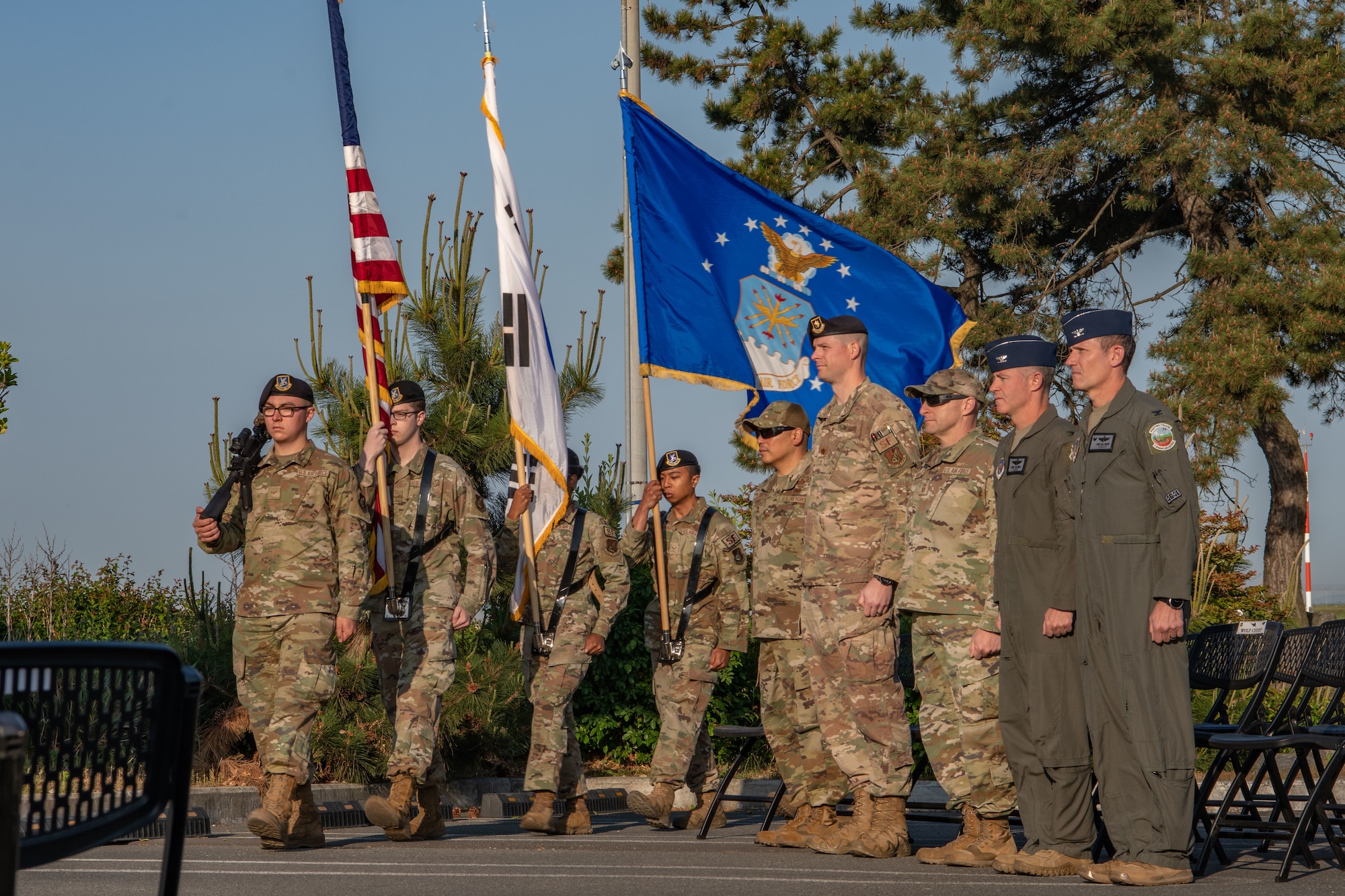 Airmen from the 8th Security Forces Squadron present colors during Police Week 2022 opening ceremony at Kunsan Air Base, Republic of Korea, May 16, 2022. National Police Week pays special recognition to law enforcement officers who have lost their lives in the line of duty for the safety and protection of others. (U.S. Air Force photo by Staff Sgt. Jesenia Landaverde)