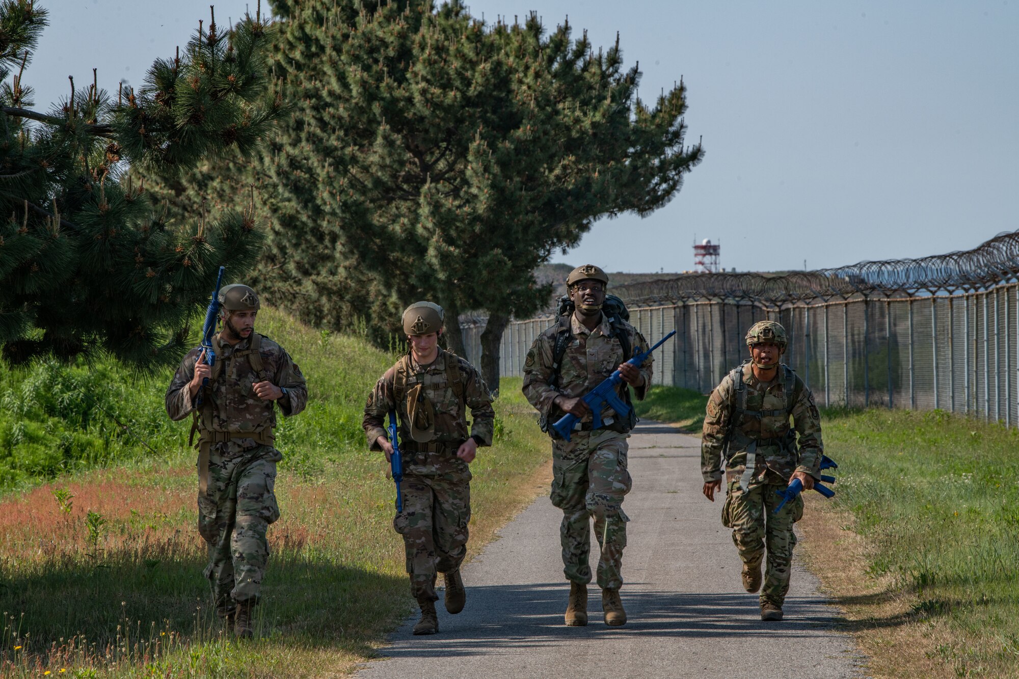 Airmen from the 8th Security Forces Squadron participate in a memorial ruck during Police Week 2022 at Kunsan Air Base, Republic of Korea, May 16, 2022. The six-mile memorial ruck march was dedicated to the security forces Airmen who have lost their lives in combat since 2001. (U.S. Air Force photo by Staff Sgt. Jesenia Landaverde)