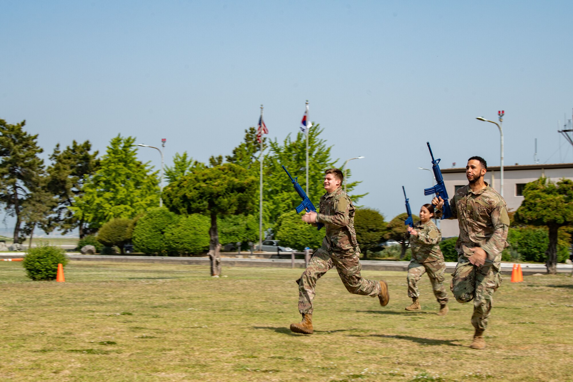 Airmen from the 8th Security Forces Squadron participate in a Defender Challenge during Police Week 2022 at Kunsan Air Base, Republic of Korea, May 17, 2022. During this week, Airmen from the 8th Fighter Wing participated in a myriad of activities to pay tribute to fallen law enforcement officers; to include a memorial run, rifle competition and relay challenge. (U.S. Air Force photo by Staff Sgt. Jesenia Landaverde)