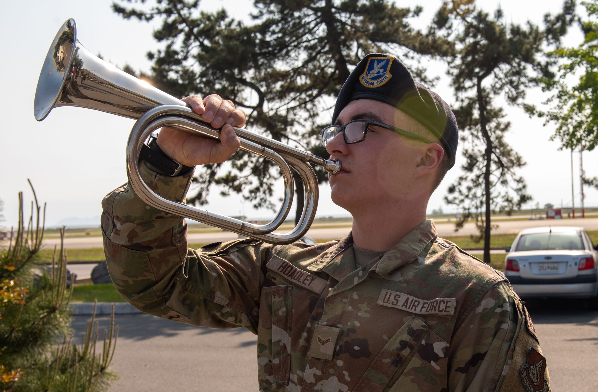 Airman First Class Cameron Hoadley, 8th Security Forces Squadron defender, plays taps during the Police Week closing ceremony on Kunsan Air Base, Republic of Korea, May 20, 2022.National Police Week pays special recognition to law enforcement officers who have lost their lives in the line of duty for the safety and protection of others.  (U.S. Air Force Photo by Tech. Sgt. Timothy Dischinat)