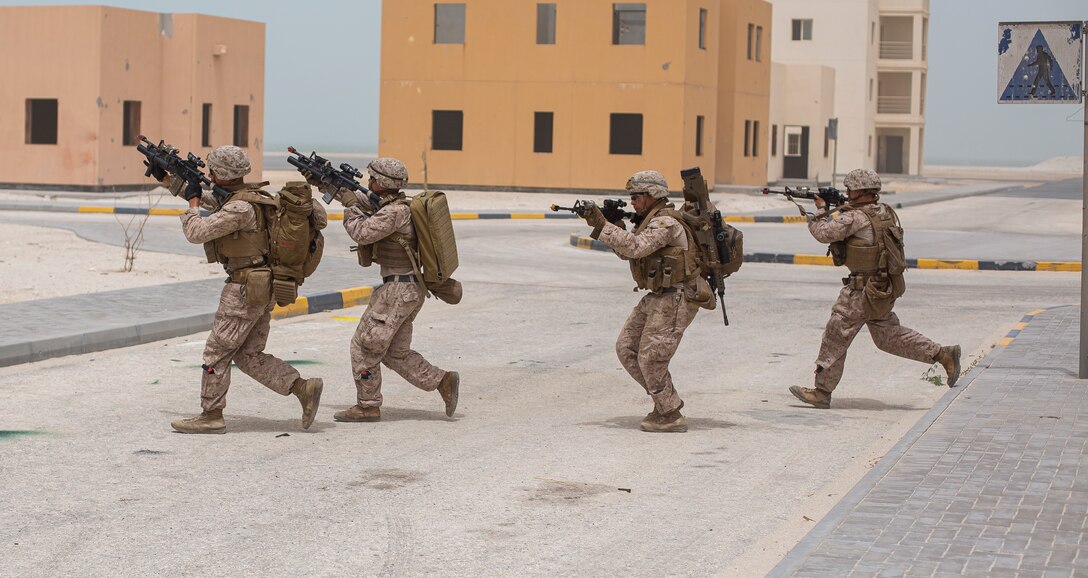 MANAMA, Bahrain (May 17, 2022) U.S. Marines assigned to Fleet Anti-Terrorism Security Team Central Command (FASTCENT) maneuver through a street while conducting squad level training during exercise Neon Defender 22 in Bahrain. Neon Defender is an annual bilateral training event between U.S. Naval Forces Central Command and Bahrain. The exercise focuses on maritime security operations, installation defense and medical response. (U.S. Marine Corps photo by Sgt. Benjamin McDonald)