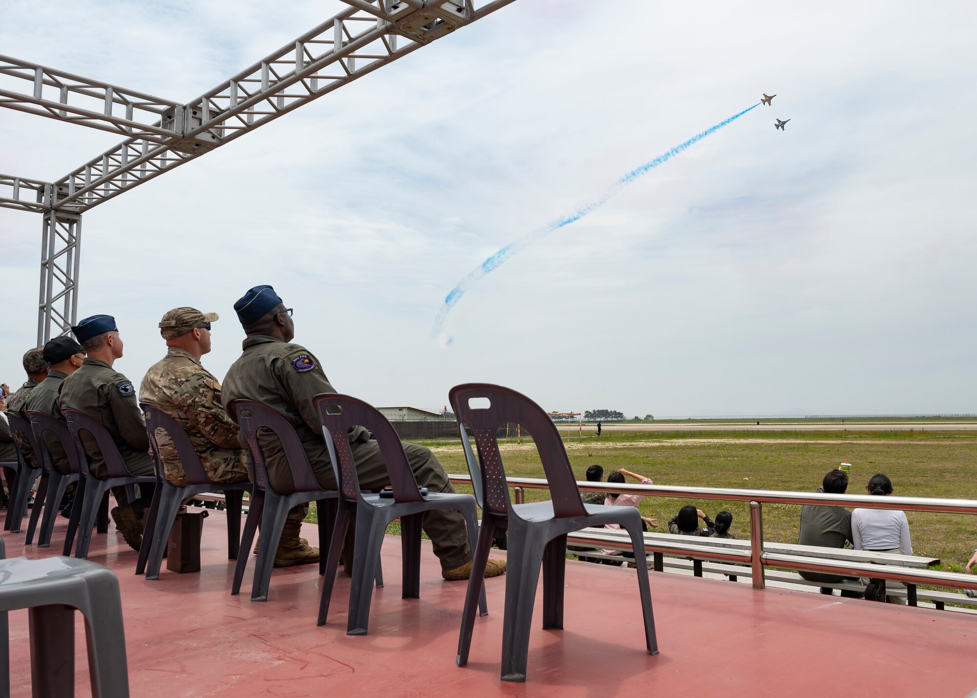 8th Fighter Wing leadership watch the Black Eagle jets perform air tricks.