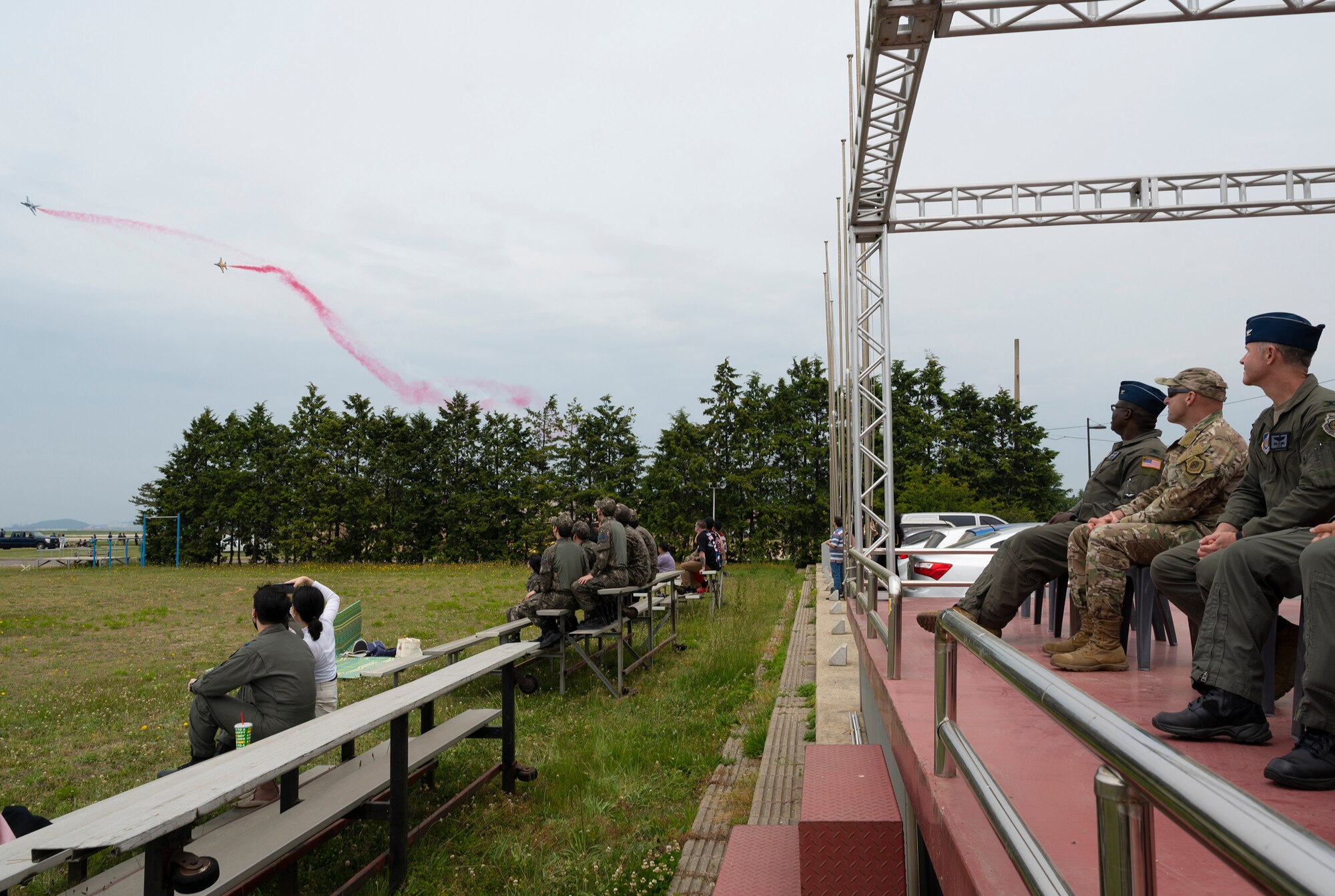 Members of the 8th Fighter Wing leadership watch the Black Eagle jets fly.