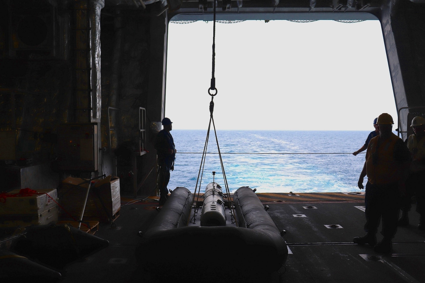 SEA OF JAPAN (May 12, 2022) Sailors onboard the Independence-class littoral combat ship USS Charleston (LCS 18) prepare to launch the MK 18 MOD 1 Swordfish and the on water transportation system (OWTS) via the Twin Boom Extensible Crane (TBEC) during Exercise Noble Vanguard. The Swordfish is an unmanned underwater vehicle with the sonar capabilities to scan the ocean floor for potential mines. Noble Vanguard serves as an enabler to reinforce tactics and techniques of different mission sets that contribute to regional stability. (U.S. Navy Photo by Ensign James French)