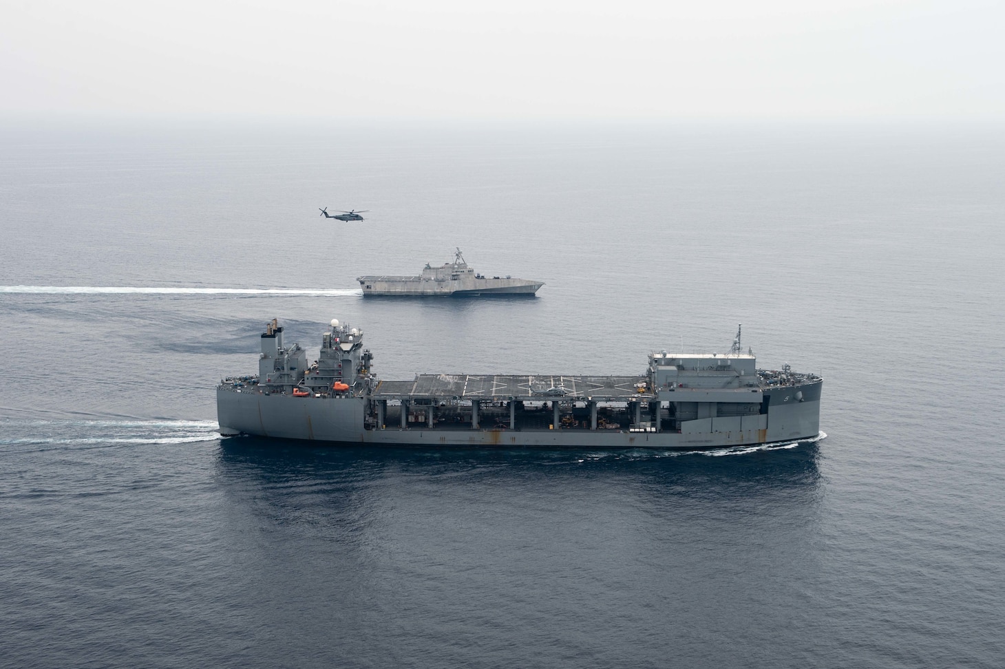 Sea of Japan (May 19, 2022)— A MH-53E Sea Dragon helicopter attached to forward deployed detachment Airborne Mine Countermeasures aircraft based in Korea, Helicopter Maritime Squadron (HM) 14, Detachment 2A flies between USS Miguel Keith and USS Charleston (LCS 18) during Exercise Noble Vanguard.  Noble Vanguard serves as an enabler to reinforce tactics and techniques of different mission sets that contribute to regional stability. (U.S. Navy photo by Mass Communication Specialist 2nd Class Gregory A. Pickett II)