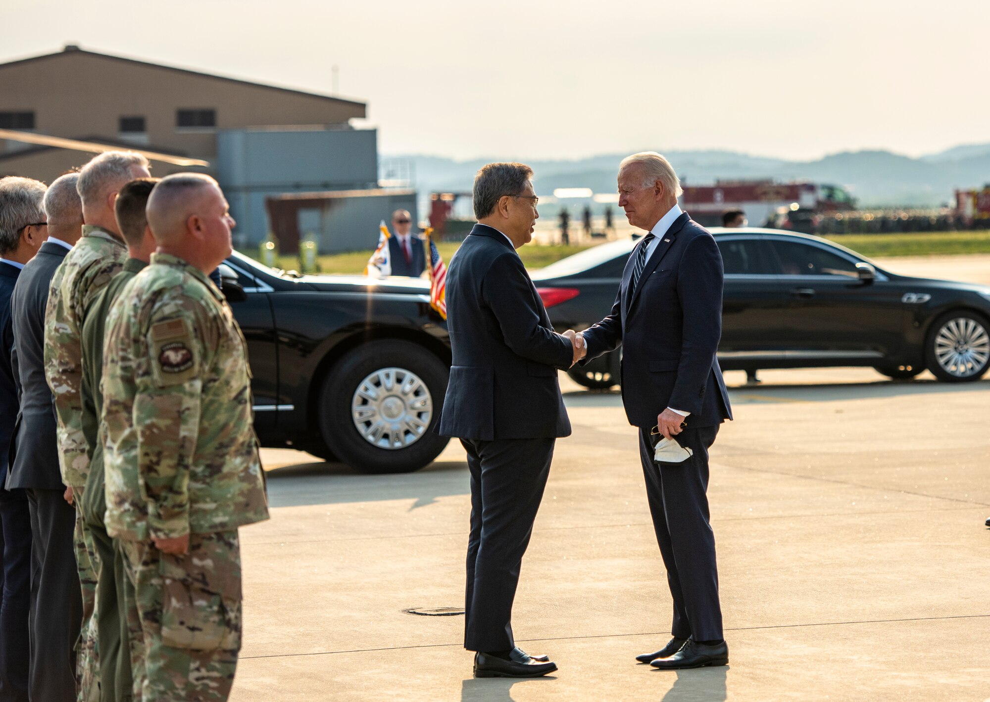United States President Joe Biden greets Republic of Korea Minister of Foreign Affairs Chung Eui-yong at Osan Air Base, ROK, May 20, 2022.