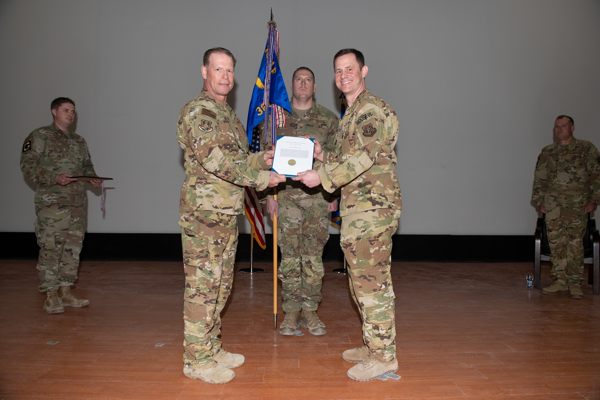 U.S. Air Force Maj. Gen. David Meyer awards the Gallant Unit Citation to U.S. Air Force Lt. Col. Patrick McLaughlin on behalf of the 385th Air Expeditionary Group during an award ceremony on Al Udeid Air Base, Qatar, May 1, 2022. The GUC has only been awarded five times in its history.