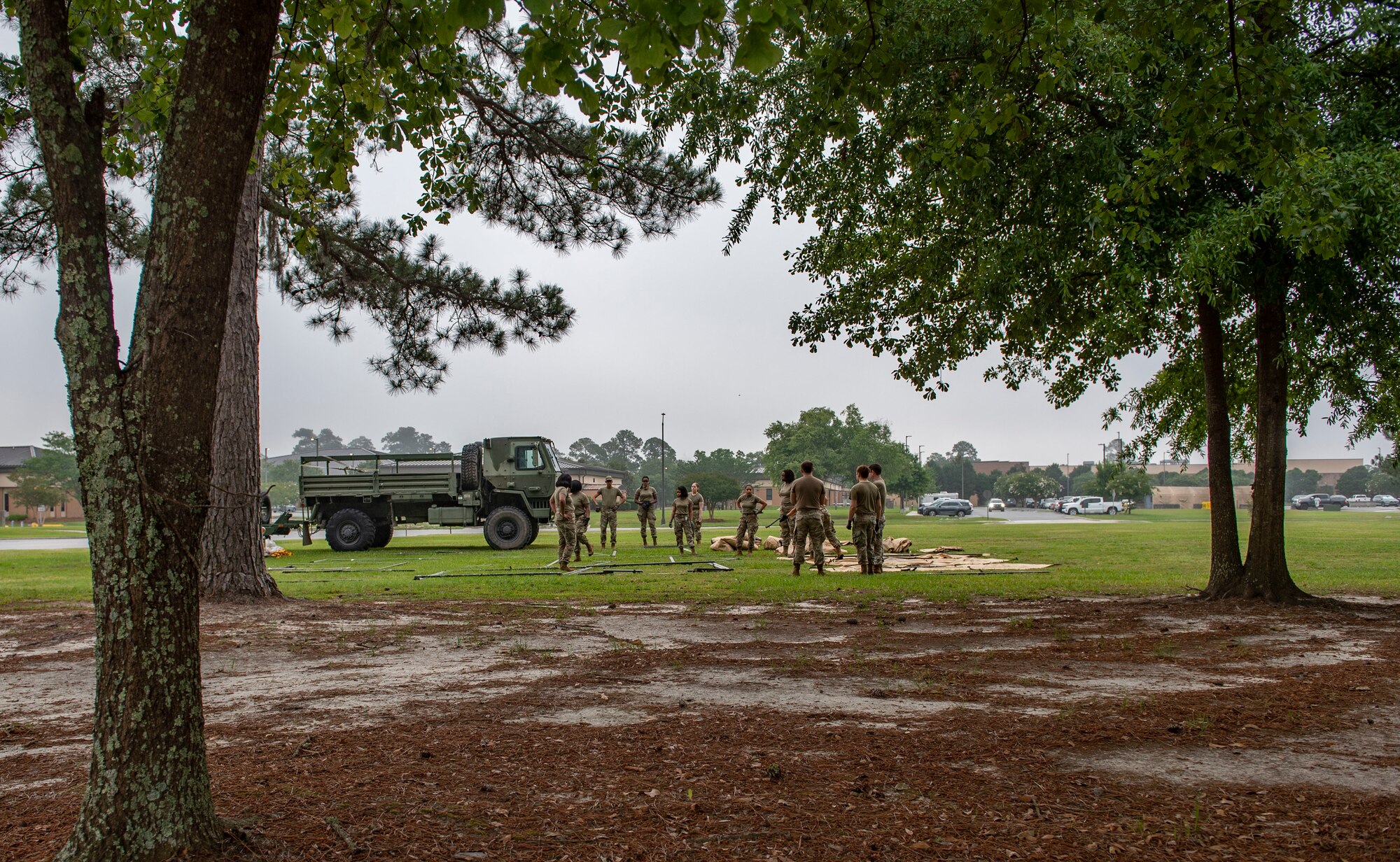 people setting up a tent from a distance
