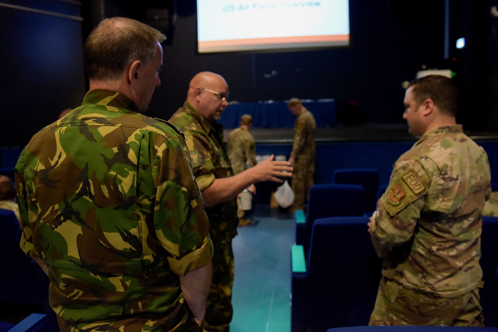 Airmen and Dutch service members discuss topics relating to EOD