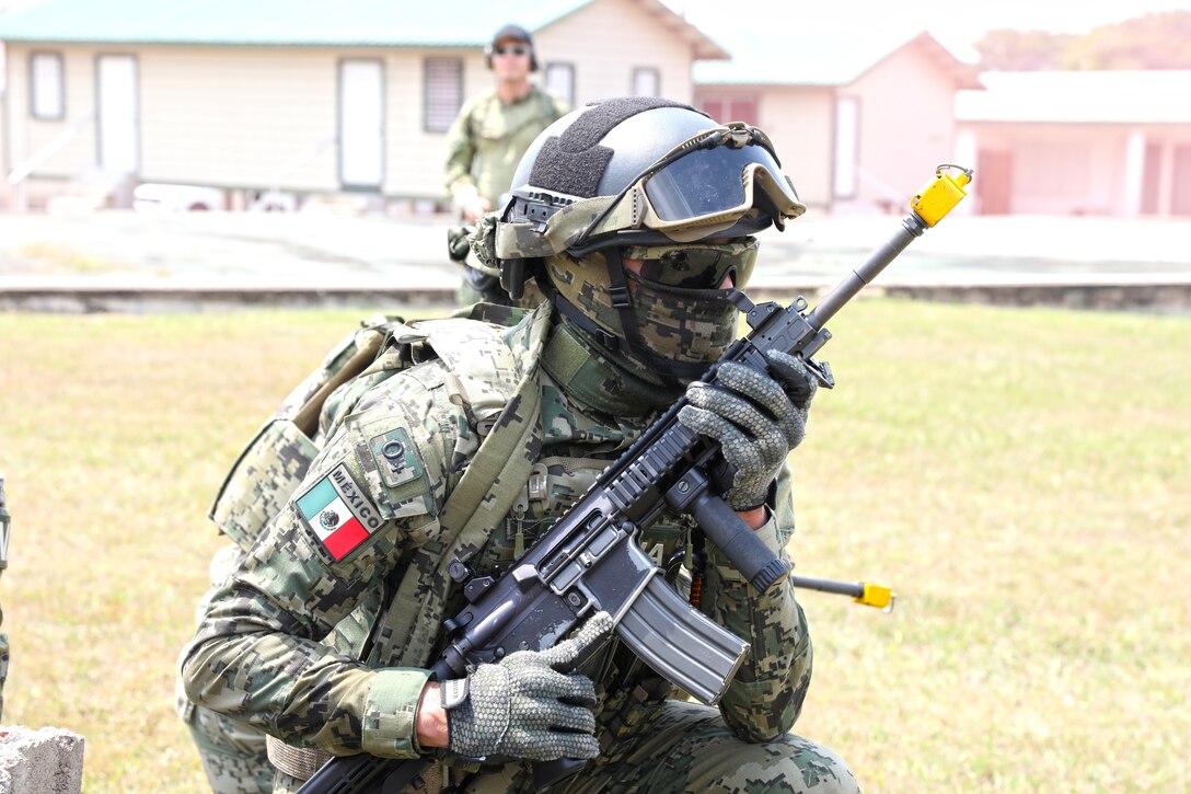 Belize Defense Force, Meixcan Marines, and US Marines conduct culminating exercises including vehicle takedown, search and seizure, arrest, riot control, and building raids May 19, 2022 at Belize Police Training Academy for Tradewinds 2022.