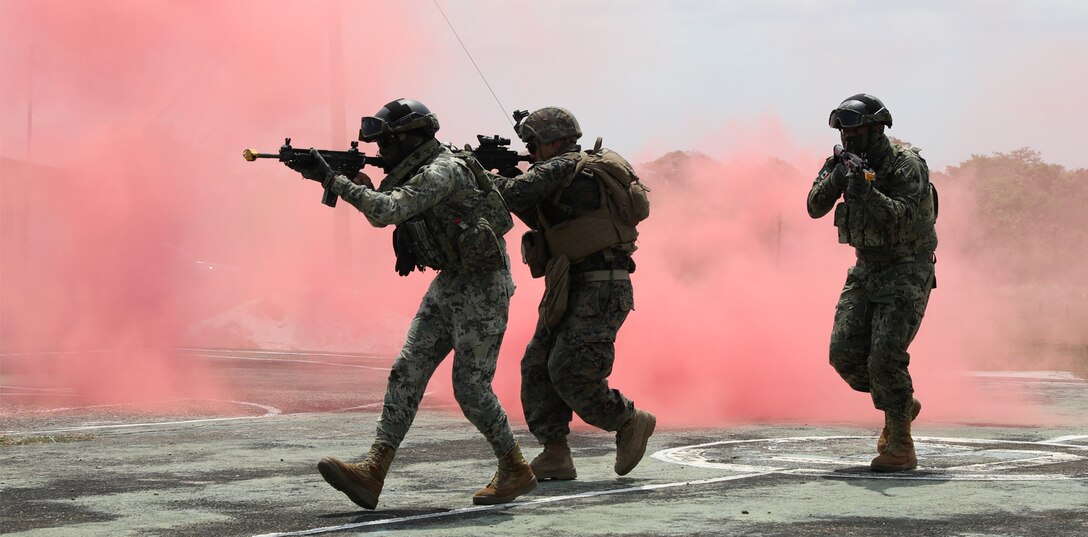 Belize Defense Force, Mexican Marines, and U.S. Marines conduct culminating exercises, including vehicle takedown, search and seizure, arrest, riot control, and building raids May 19, 2022, at Belize Police Training Academy for Tradewinds 2022.