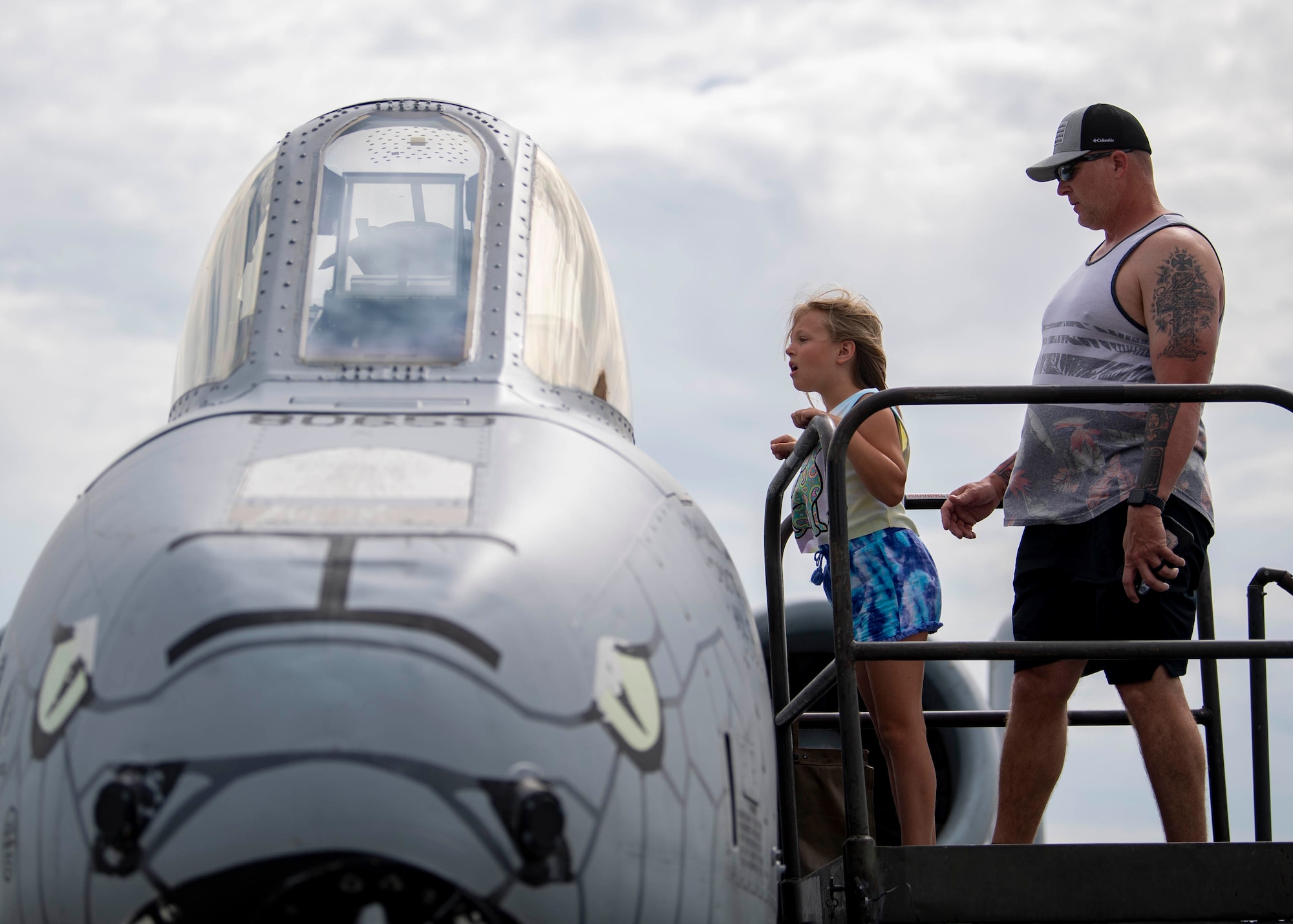 A family marvels at the A-10 Thunderbolt II during the 2022 Thunder Over Dover Airshow, May 22, 2022, at Dover Air Force Base, Delaware. The event was the first airshow and open house held at Dover AFB since September 2019. (U.S. Air Force Photo by Tech. Sgt. J.D. Strong II)