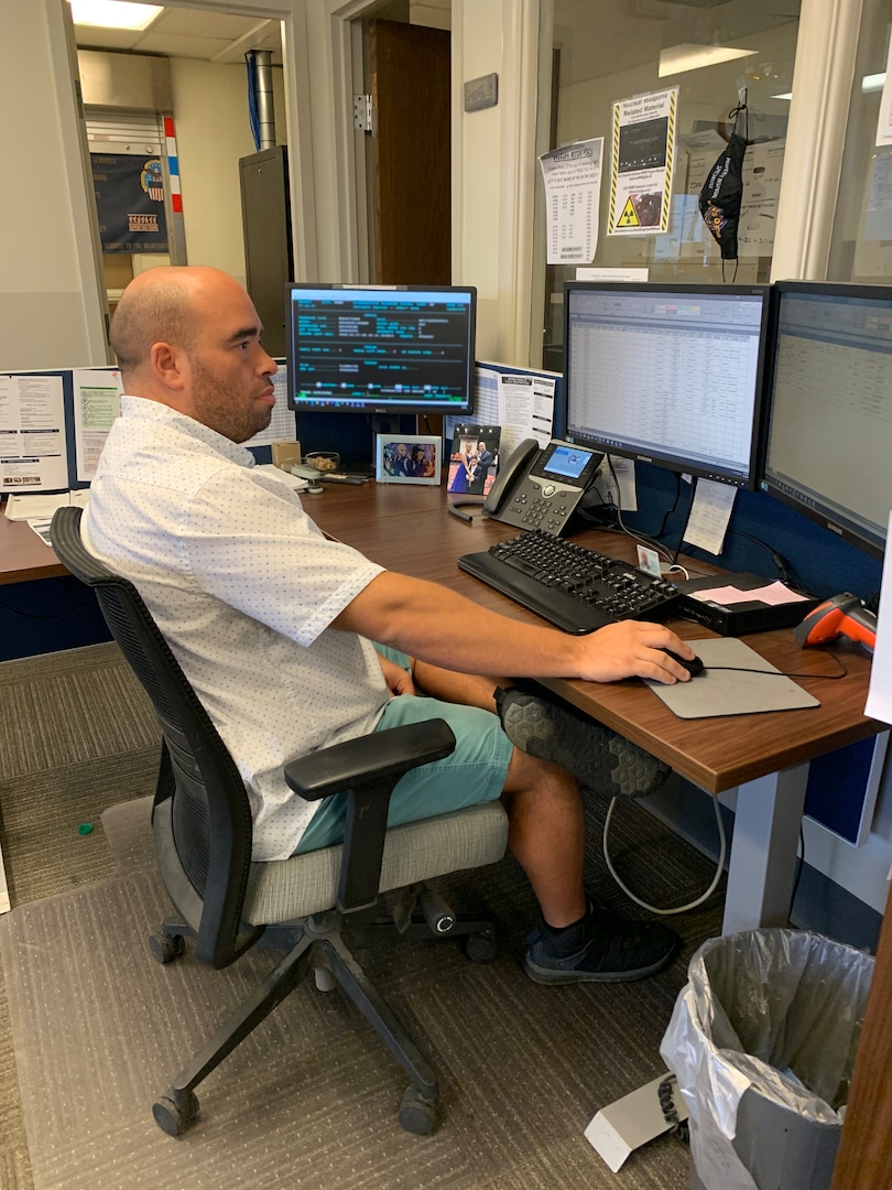 Billy Sapp, a property disposal specialist works at his computer at DLA Disposition Services at Fort Riley, Kansas.