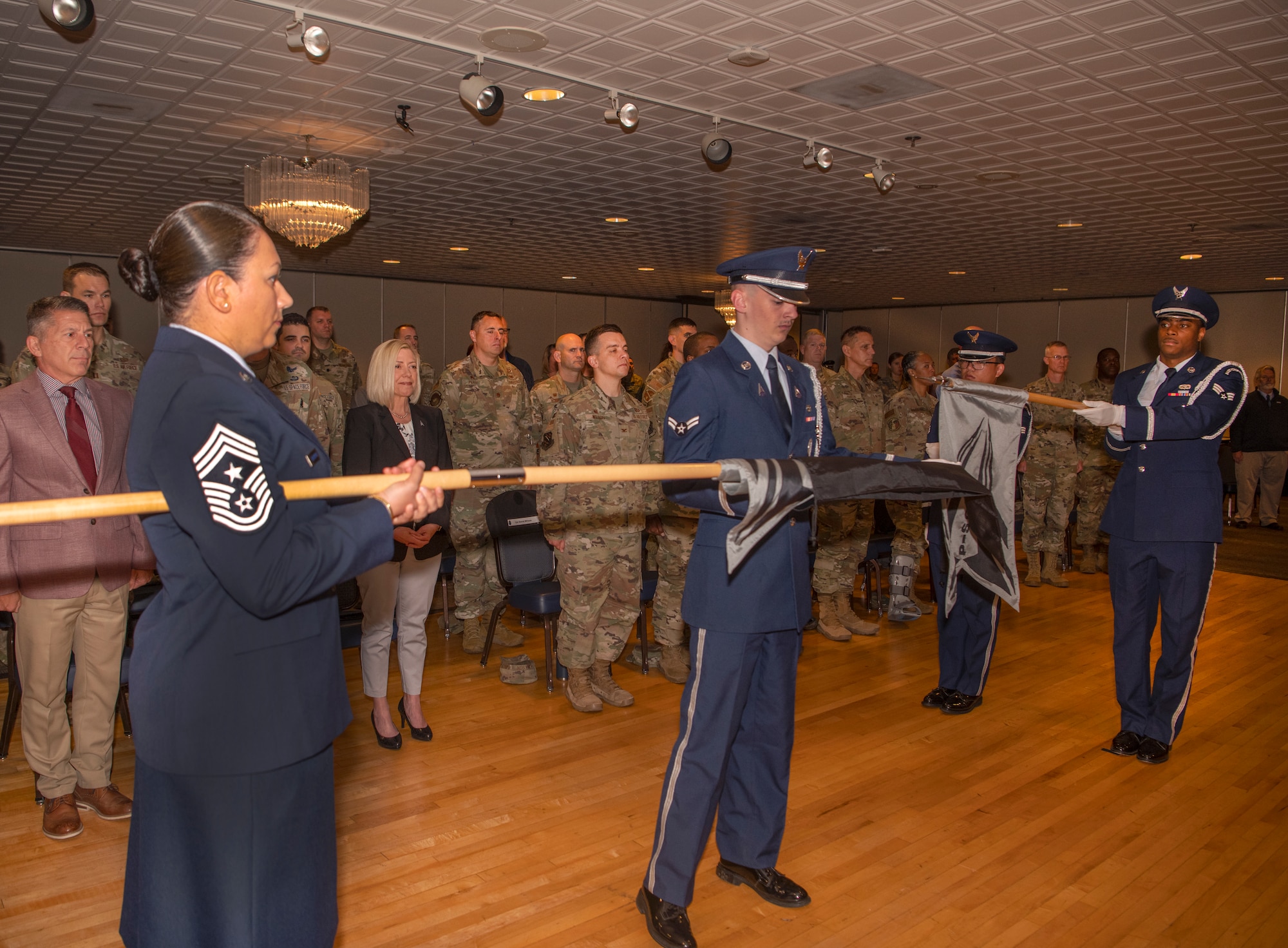 Airmen unfurl the new Space Delta 1 guidon