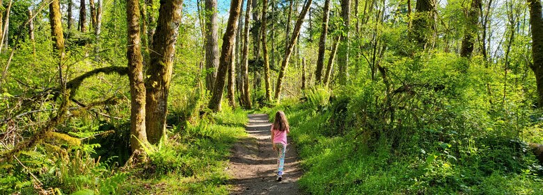 Jason Anderson's 8-year-old daughter explores the Woodard Bay Natural Resources Conservation Area, Olympia, Washington.