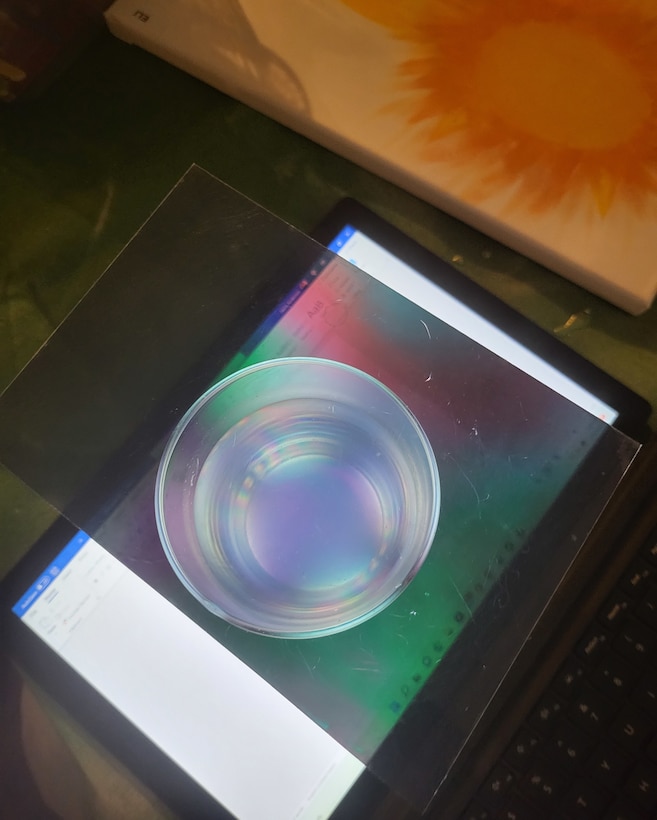 Photo of the results of the polarized light experiment. Using two polarized films, Anderson and his daughter learned how lights "twists" as it travels through a glass of sugar water.