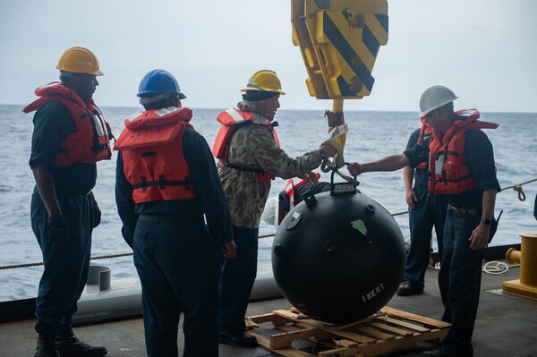 Sea of Japan (May 15, 2022)— Sailors and civilian mariners assigned to expeditionary sea base ship USS Miguel Keith (ESB 5) prepare to launch a training mine-shape during Exercise Noble Vanguard. Noble Vanguard serves as an enabler to reinforce tactics and techniques of different mission sets that contribute to regional stability. (U.S. Navy photo by Mass Communication Specialist 2nd Class Gregory A. Pickett II)