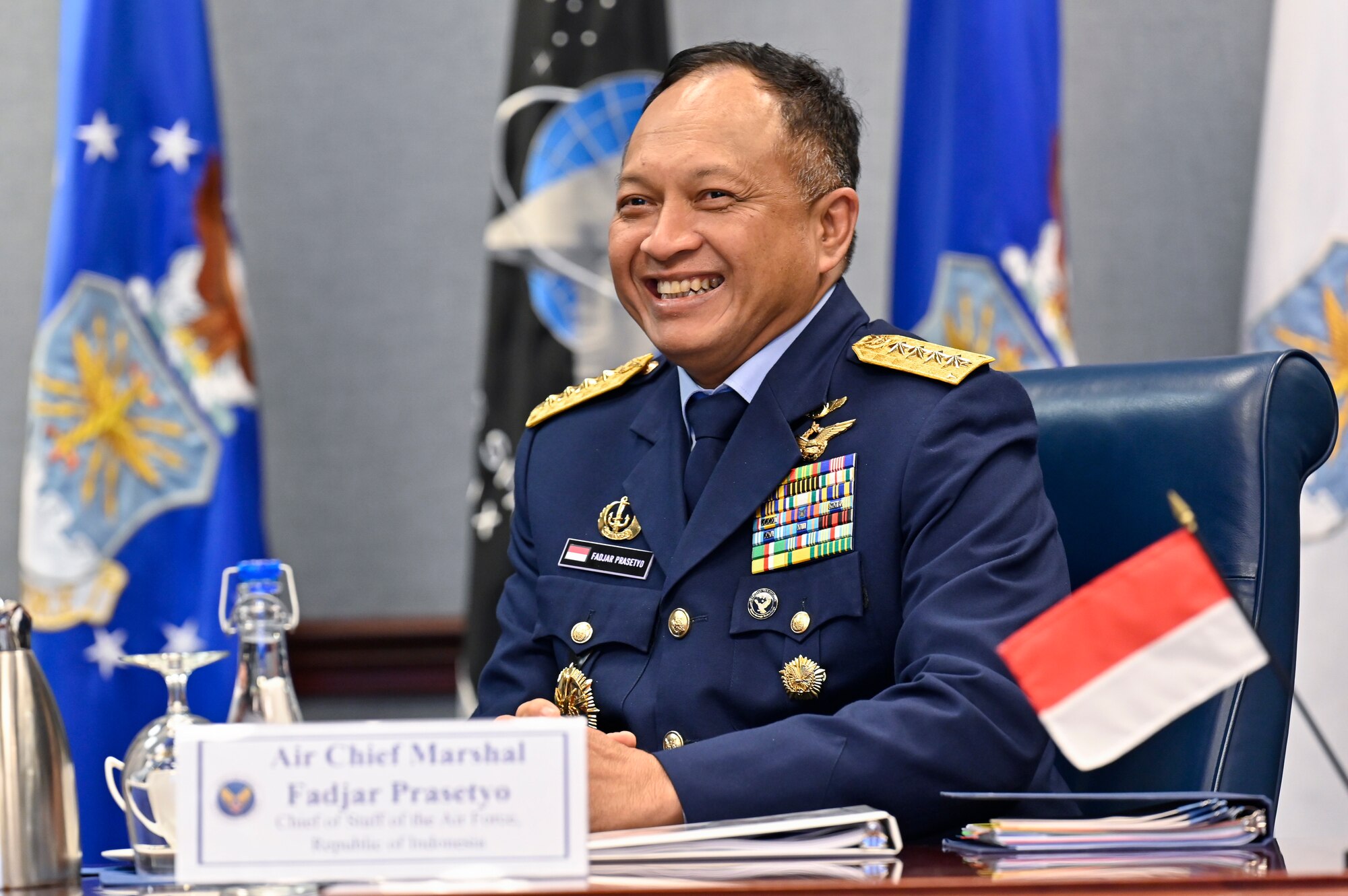 Air Chief Marshal Fadjar Prasetyo, chief of staff of the Indonesian Air Force, speaks with Kelli Seybolt, deputy undersecretary of the Air Force for international affairs, during a meeting.